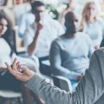 Man talking to a small audience
